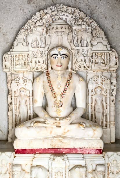Adorned marble idol presented in the temple's devotional setting